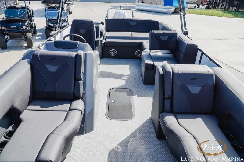 Slide: The Image of Luxurious 2026 Evotti 523CS boat interior with plush seating at Lake Norman Marina. - 13