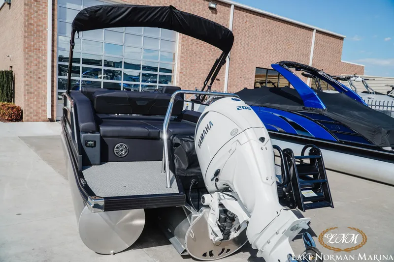 Slide: The Image of 2026 Evotti 523CS pontoon boat with Yamaha engine at Lake Norman Marina. - 4