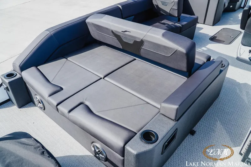 Slide: The Image of Luxurious seating area on 2026 Evotti 523CS boat with cup holders and speakers. - 6