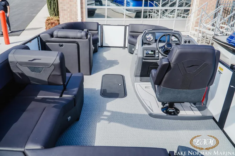 Slide: The Image of 2026 Evotti 523CS boat interior with modern seating and control panel at Lake Norman Marina. - 7