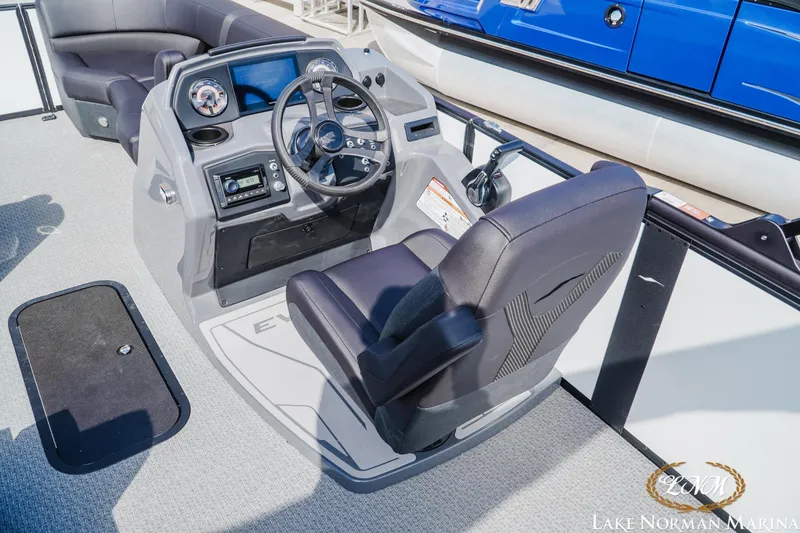 Slide: The Image of 2026 Evotti 523CS boat cockpit with steering wheel and control panel at Lake Norman Marina. - 8
