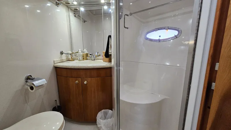 Slide: The Image of Bathroom interior of 2000 Carver 450 Voyager Pilothouse yacht, featuring shower and vanity. - 47