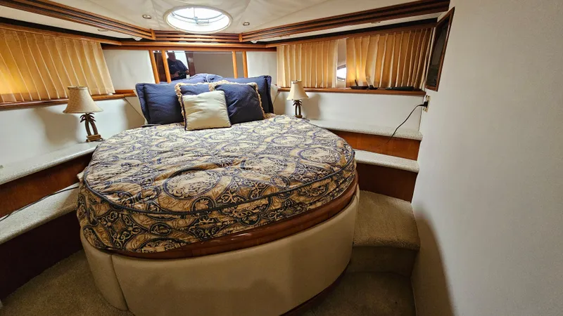 Slide: The Image of Luxurious bedroom in 2000 Carver 450 Voyager Pilothouse yacht with elegant bedding. - 48