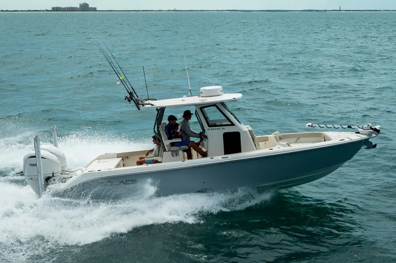 The Image of Manufacturer Provided Image: 2026 Solace 28 HCS boat cruising on open water with fishing rods. - 0