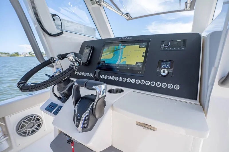 Slide: The Image of Manufacturer Provided Image: Helm of 2026 Solace 28 HCS boat with advanced navigation system and controls. - 5