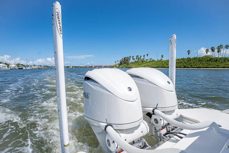 Slide: The Image of Manufacturer Provided Image: 2026 Solace 28 HCS boat with dual outboard engines on a sunny day. - 9