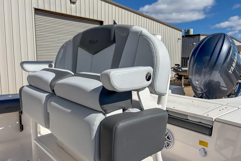Slide: The Image of 2025 Robalo 226 Cayman boat seat with Yamaha engine in background. - 6