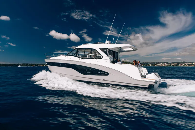 Slide: The Image of 2026 Beneteau Antares 12 Coupe cruising on open sea. - 2