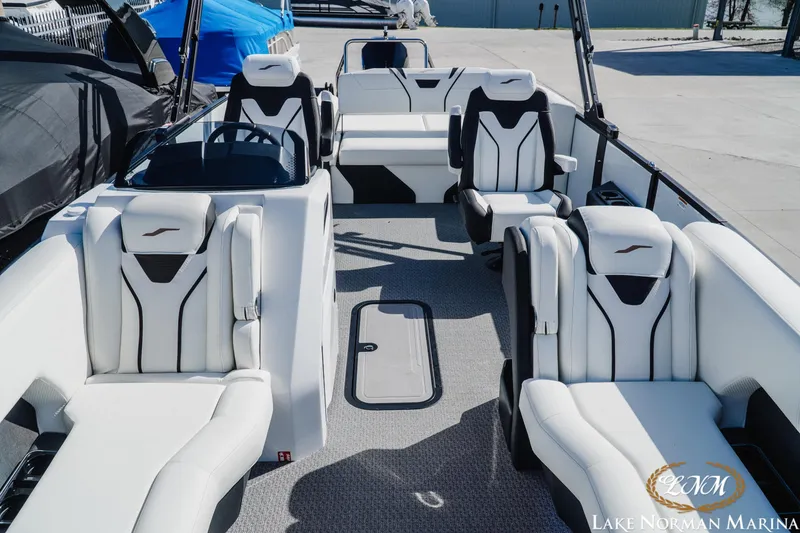Slide: The Image of Luxurious 2026 Evotti 723CS boat interior with sleek white seating at Lake Norman Marina. - 13