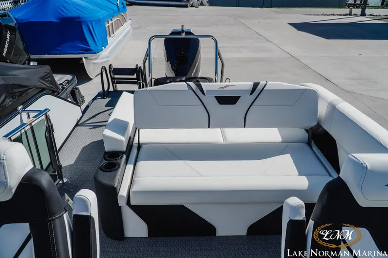 Slide: The Image of 2026 Evotti 723CS boat interior with white seating at Lake Norman Marina. - 18