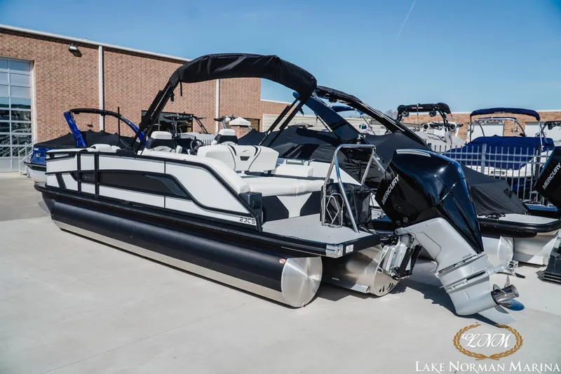 Slide: The Image of 2026 Evotti 723CS pontoon boat at Lake Norman Marina, featuring sleek design and powerful Mercury engine. - 3