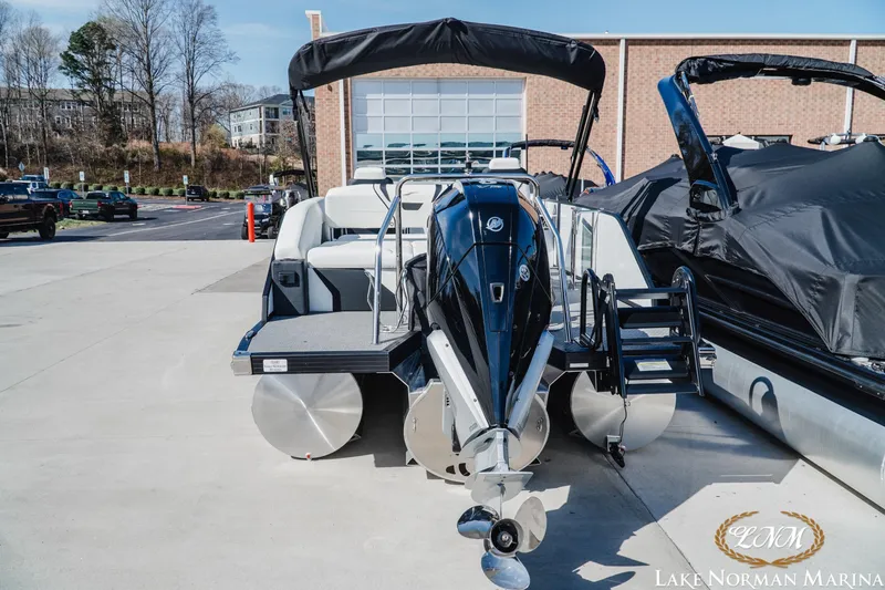 Slide: The Image of 2026 Evotti 723CS pontoon boat at Lake Norman Marina, featuring sleek design and powerful engine. - 4