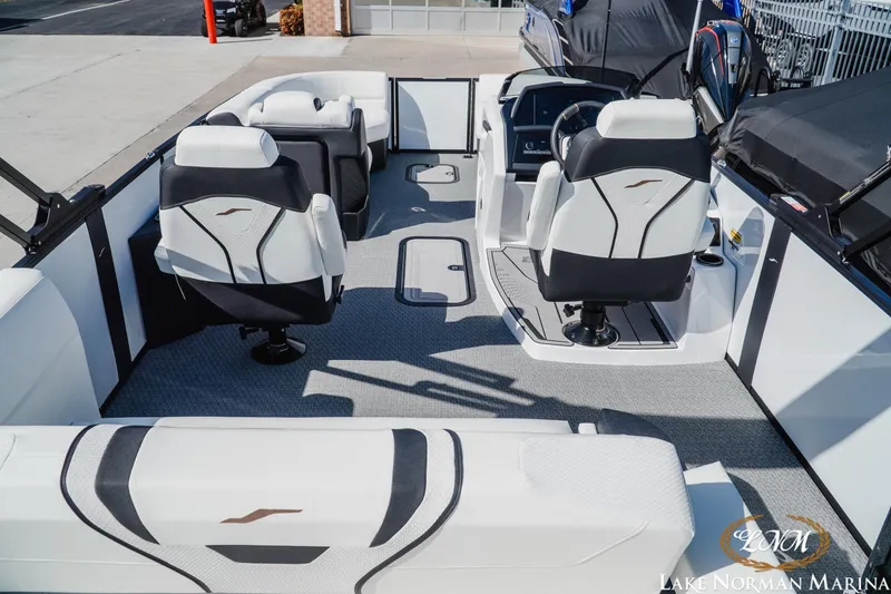 Slide: The Image of Interior of 2026 Evotti 723CS boat with modern seating and dashboard at Lake Norman Marina. - 7