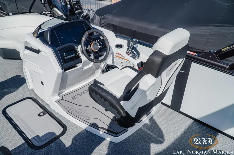Slide: The Image of Cockpit of 2026 Evotti 723CS boat with modern steering and controls at Lake Norman Marina. - 8