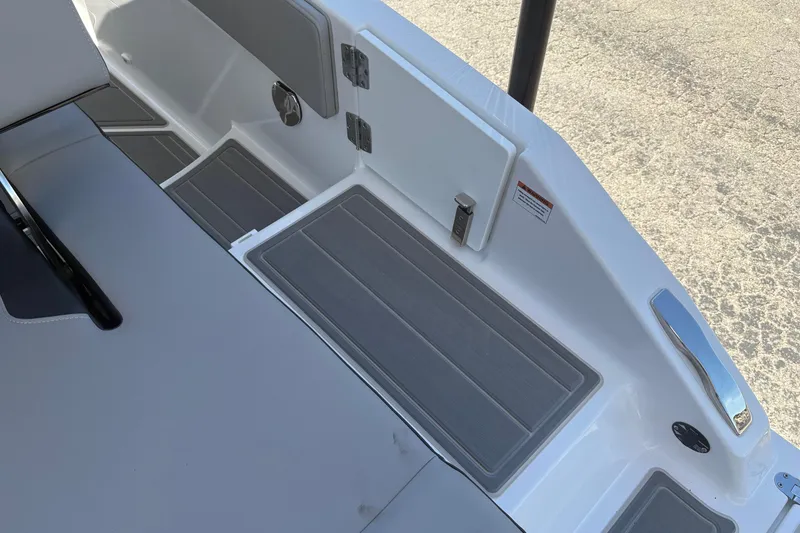 Slide: The Image of 2026 Monterey Elite 25 SD boat interior with sleek seating and storage compartments. - 15