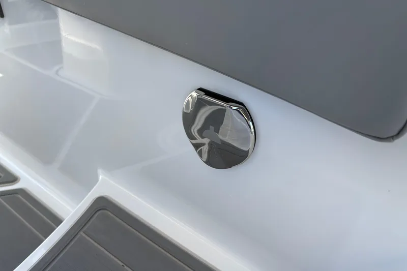 Slide: The Image of 2026 Monterey Elite 25 SD boat detail with sleek chrome finish. - 17