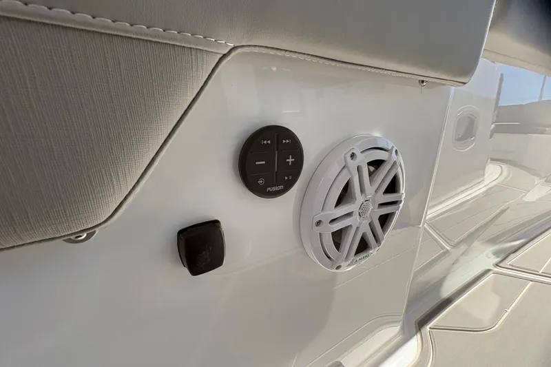 Slide: The Image of 2026 Monterey Elite 25 SD boat speaker and control panel detail. - 21