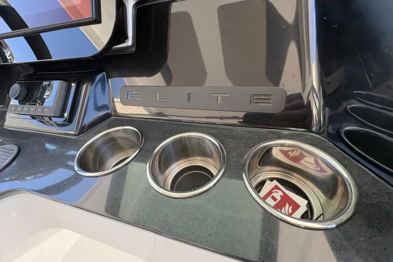 Slide: The Image of Dashboard of 2026 Monterey Elite 25 SD with cup holders and control panel. - 25