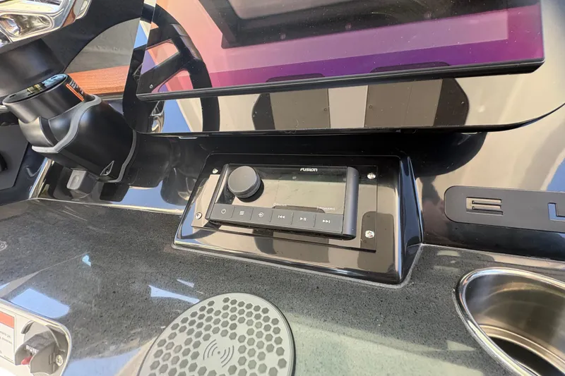 Slide: The Image of 2026 Monterey Elite 25 SD dashboard with Fusion audio system and controls. - 27