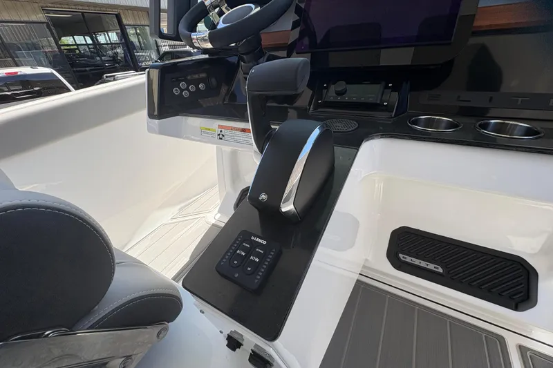 Slide: The Image of 2026 Monterey Elite 25 SD boat dashboard with steering wheel and control panel. - 29