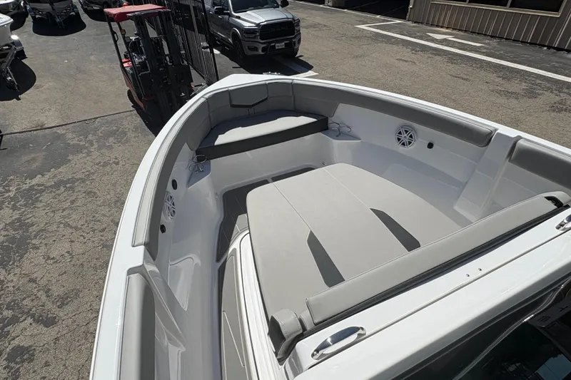 Slide: The Image of 2026 Monterey Elite 25 SD boat interior with gray seating and speakers. - 38