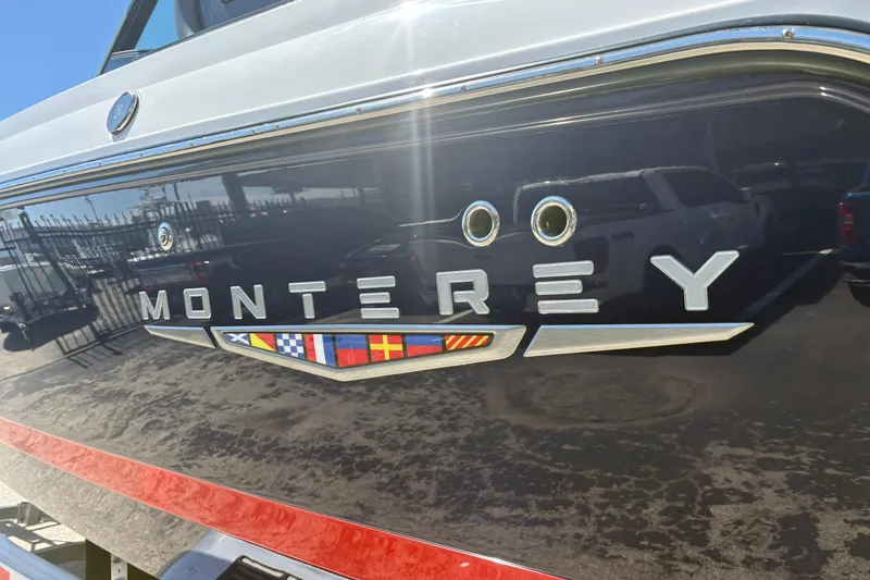Slide: The Image of 2026 Monterey Elite 25 SD boat with sleek design and nautical flags. - 7