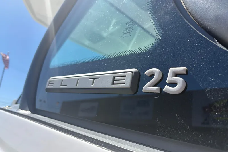 Slide: The Image of 2026 Monterey Elite 25 SD logo on vehicle window, close-up view. - 9