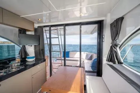 Slide: The Image of Interior view of 2026 Beneteau Antares 11 Fly yacht with ocean backdrop. - 8