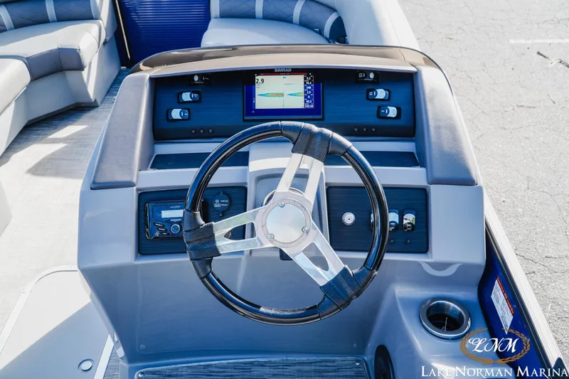 Slide: The Image of Steering console of a 2021 Bennington 22LSR boat with navigation display and controls. - 10