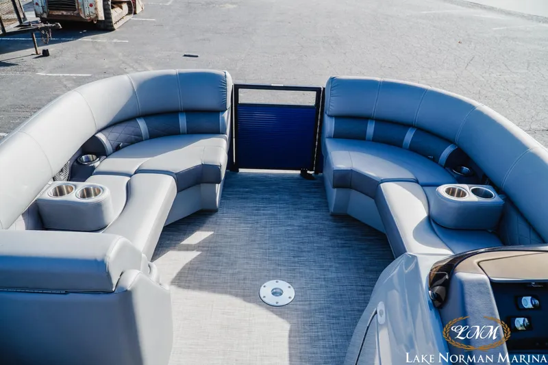 Slide: The Image of 2021 Bennington 22LSR pontoon boat interior with plush seating and cup holders. - 11