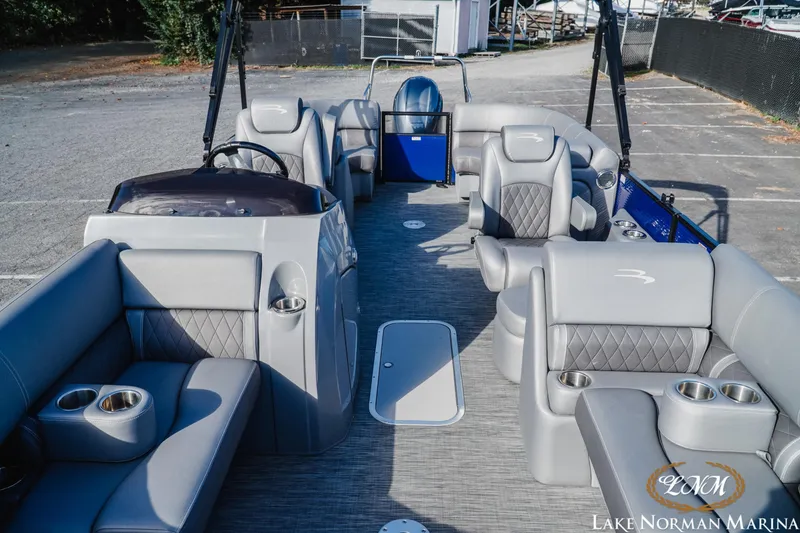 Slide: The Image of 2021 Bennington 22LSR pontoon boat interior with luxurious seating and cup holders. - 13