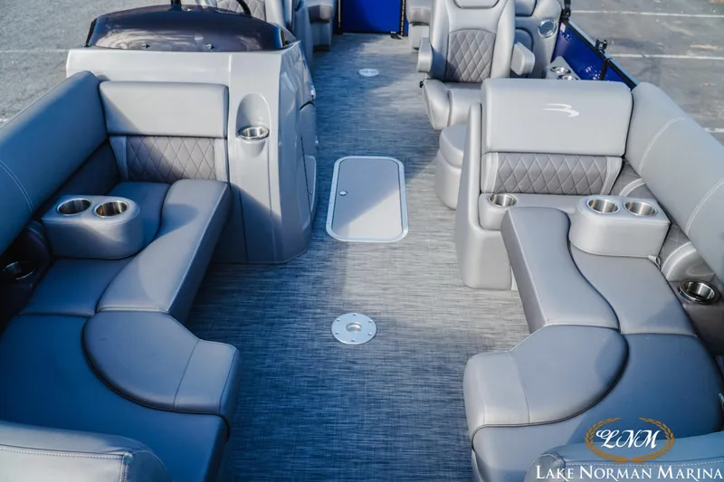 Slide: The Image of 2021 Bennington 22LSR pontoon boat interior with gray seating and cup holders. - 14