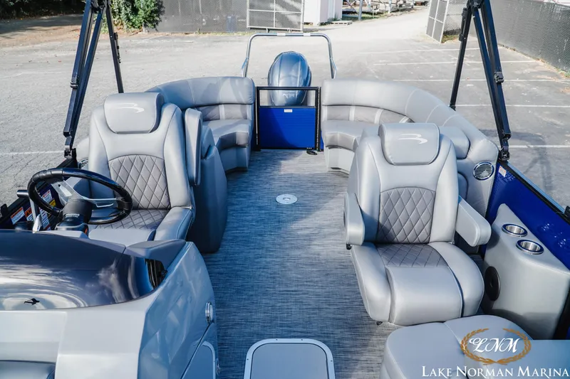 Slide: The Image of 2021 Bennington 22LSR pontoon boat interior with luxurious seating at Lake Norman Marina. - 15
