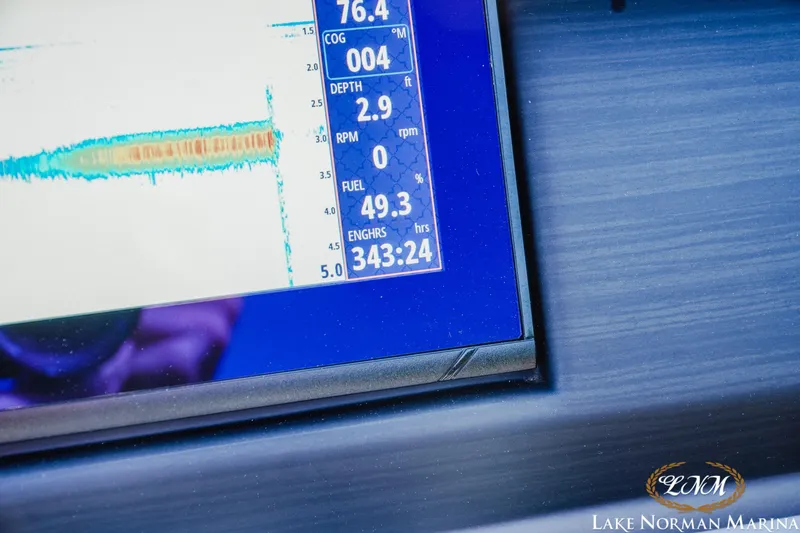 Slide: The Image of Dashboard display of a 2021 Bennington 22LSR boat showing fuel and engine hours. - 17