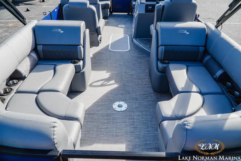 Slide: The Image of 2021 Bennington 22LSR pontoon boat interior with luxurious gray seating and cup holders. - 7