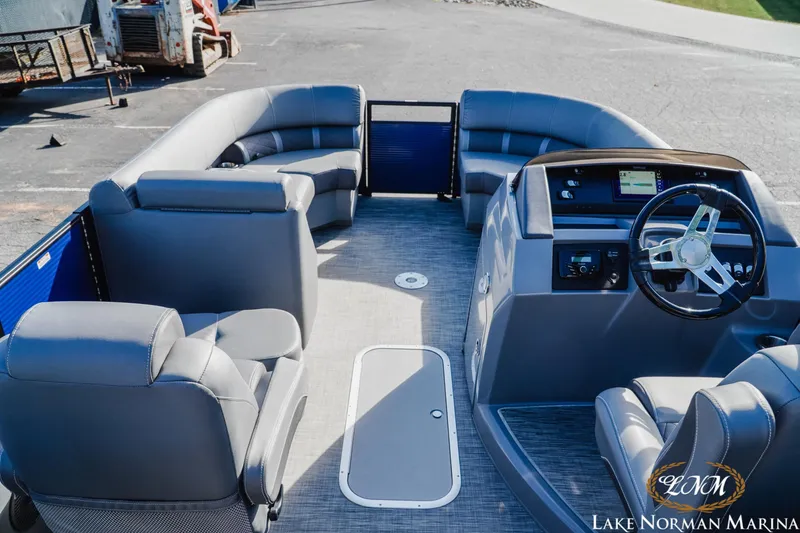 Slide: The Image of 2021 Bennington 22LSR pontoon boat interior with modern seating and steering console. - 8