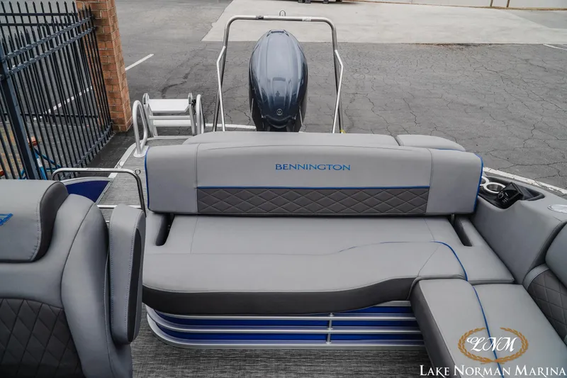Slide: The Image of 2024 Bennington 23LSB pontoon boat with luxurious seating at Lake Norman Marina. - 13