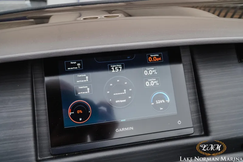 Slide: The Image of Garmin display on 2024 Bennington 23LSB boat dashboard, showing engine and fuel metrics. - 14