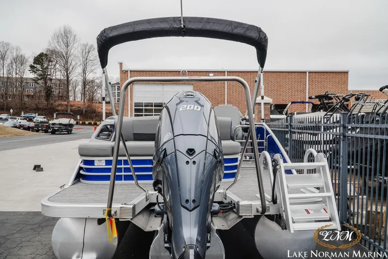 Slide: The Image of 2024 Bennington 23LSB pontoon boat with powerful 200 HP engine at Lake Norman Marina. - 4