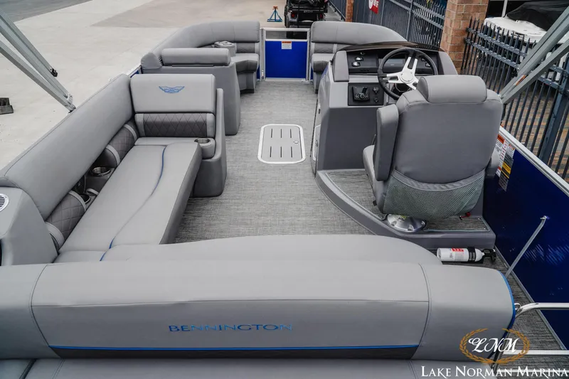 Slide: The Image of 2024 Bennington 23LSB pontoon boat interior with gray seating and modern helm. - 5