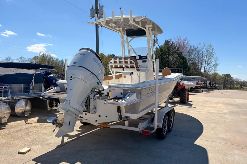 Slide: The Image of 2026 Pioneer 220 Bay Sport boat on trailer with Suzuki outboard motor. - 4