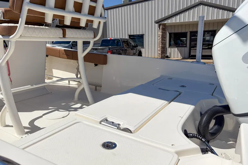 Slide: The Image of 2026 Pioneer 220 Bay Sport boat interior with seating and storage compartments. - 6