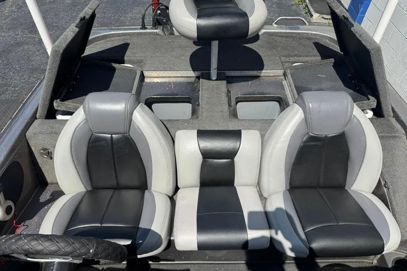 Slide: The Image of 2014 Skeeter TZX190 boat interior with black and gray seating and storage compartments. - 3