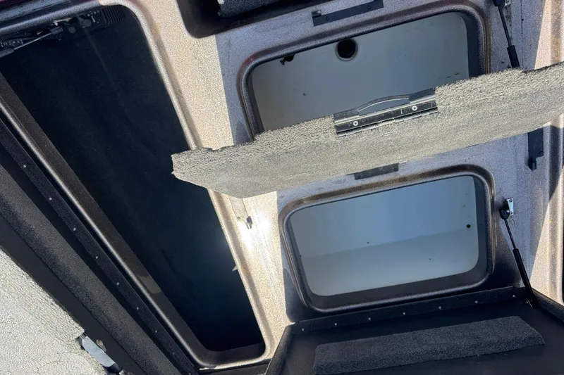 Slide: The Image of Open storage compartments on a 2014 Skeeter TZX190 boat. - 5