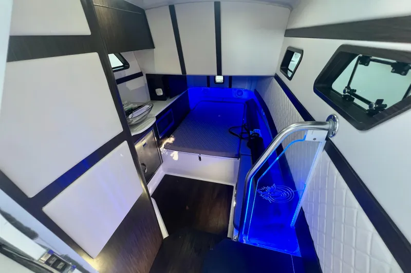 Slide: The Image of Luxurious interior of 2020 Edgewater 370CC boat with modern lighting and sleek design. - 13