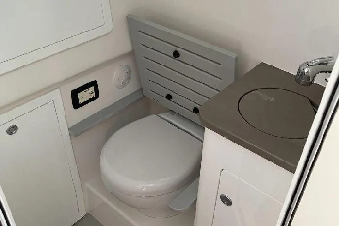 Slide: The Image of Interior of 2020 Edgewater 370CC featuring toilet and sink. - 16