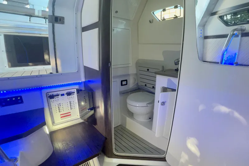 Slide: The Image of Interior of 2020 Edgewater 370CC boat featuring modern bathroom and control panel. - 17