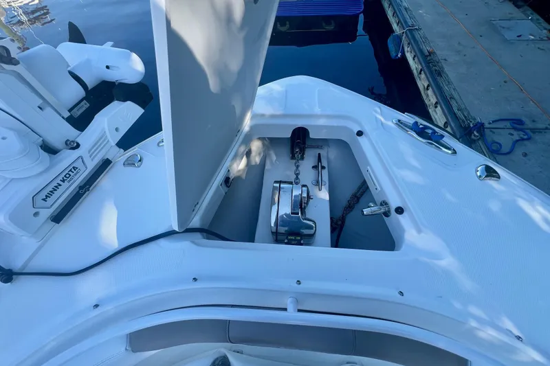 Slide: The Image of 2020 Edgewater 370CC boat anchor compartment with Minn Kota trolling motor. - 34