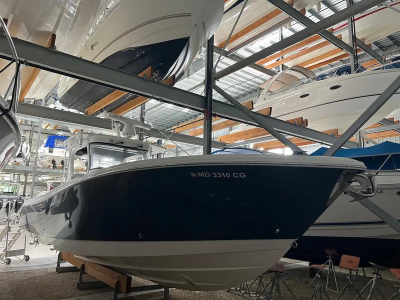 Slide: The Image of Edgewater 370CC 2020 boat in storage facility, side view. - 6