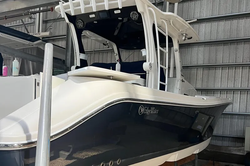 Slide: The Image of 2020 Edgewater 370CC boat in storage, showcasing sleek design and modern features. - 9